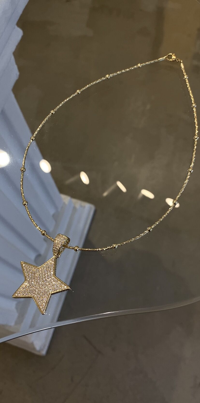 Çelik yıldız kolye